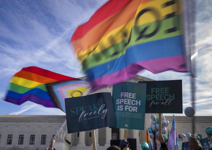 People on both sides of the debate rally outside the Supreme Court in Washington, Monday, Dec. 5, 2022.
