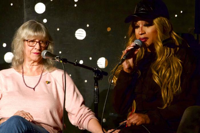 Lauren Mathers, director of Sandhills Pride, left, comforts drag queen Naomi Dix as she tears up while recounting the threats she received leading up to a recent drag performance while speaking on a panel with LGBTQ community leaders in Durham, N.C., on Thursday, Dec. 8, 2022.