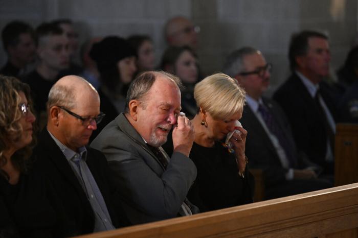 Jeff and Sabrina Aston morn their son, Daniel Aston, during a memorial service held for him at Shove Memorial Chapel on the Colorado College's campus on Dec. 7, 2022, in Colorado Springs, Colo. 