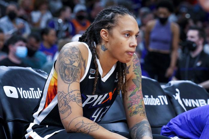 Phoenix Mercury center Brittney Griner sits during the first half of Game 2 of basketball's WNBA Finals against the Chicago Sky, Wednesday, Oct. 13, 2021, in Phoenix.