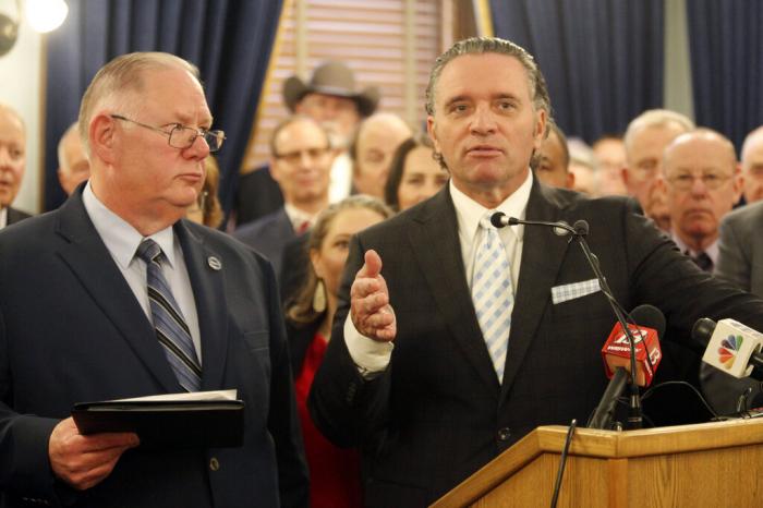 Kansas Senate President Ty Masterson, right, R-Andover, speaks during a news conference for announcing Republican legislative leaders' agenda for the year, with House Speaker Dan Hawkins, left, watching, Tuesday, Jan. 10, 2023, at the Statehouse in Topeka, Kan.