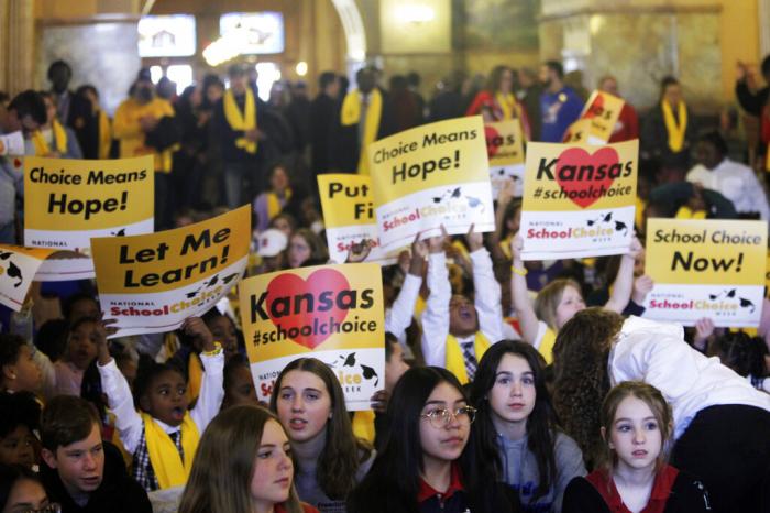 Private and home school students, their parents and advocates crowed part of the second floor of the Kansas Statehouse for a rally for giving parents tax dollars earmarked for public schools and allowing them to spend it how they choose on education.
