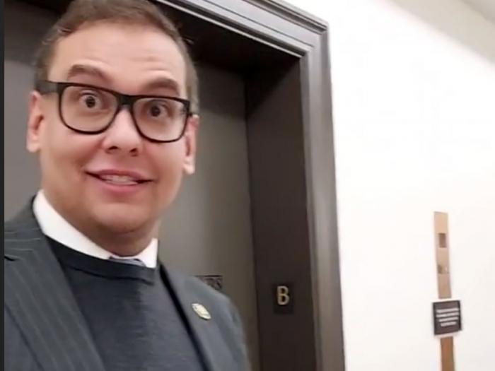 George Santos responds to a question in the halls of Congress