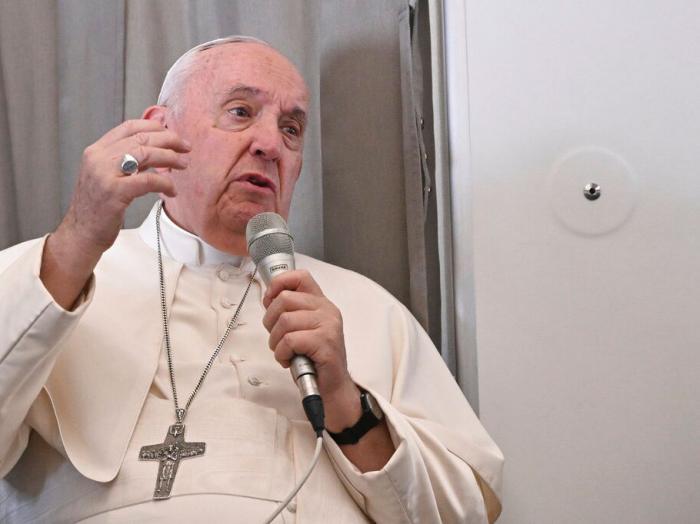 Pope Francis meets the journalists during an airborne press conference aboard the airplane directed to Rome, at the end of his pastoral visit to Congo and South Sudan, Sunday, Feb. 5, 2023. (Tiziana Fabi/Pool Photo Via AP)