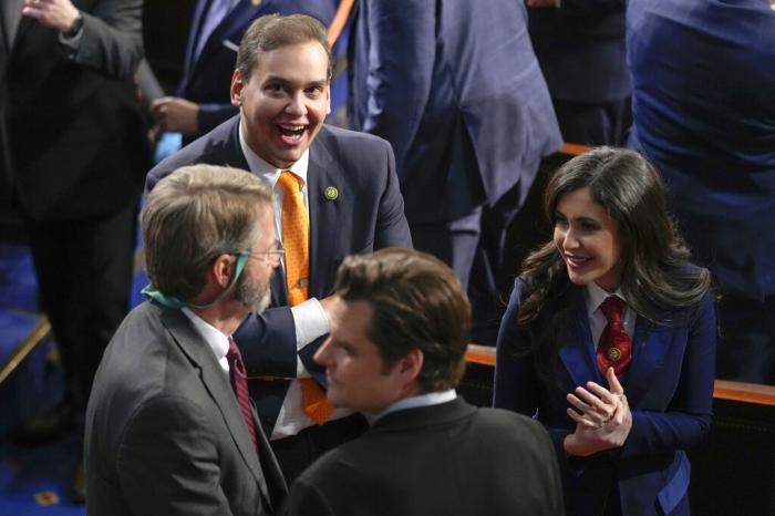 Rep. George Santos, R-N.Y., Rep. Matt Gaetz, R-Fla., and other Republicans gather in the House Chamber before President Joe Biden delivers the State of the Union address to a joint session of Congress at the U.S. Capitol.