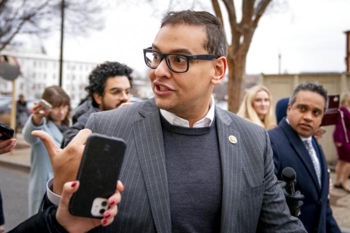 Rep. George Santos, R-N.Y., leaves a House GOP conference meeting on Capitol Hill in Washington, Jan. 25, 2023. 