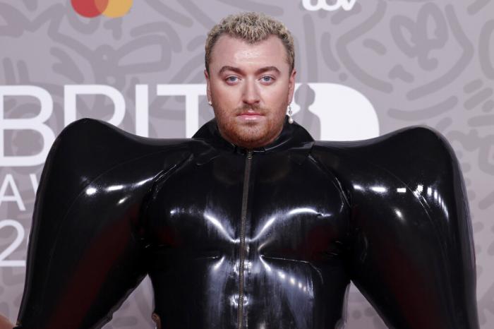 Sam Smith poses for photographers upon arrival at the Brit Awards 2023 in London, Saturday, Feb. 11, 2023. 