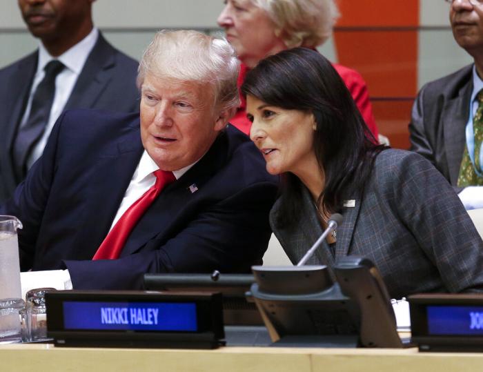 President Donald Trump speaks with U.S. Ambassador to the United Nations Nikki Haley before a meeting during the United Nations General Assembly at U.N. headquarters, Sept. 18, 2017.
