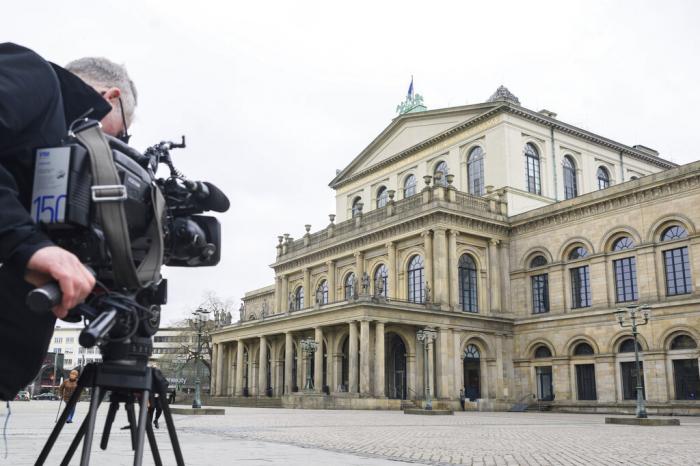A TV cameraman films the State Opera in Hanover, Germany, Feb. 13, 2023.