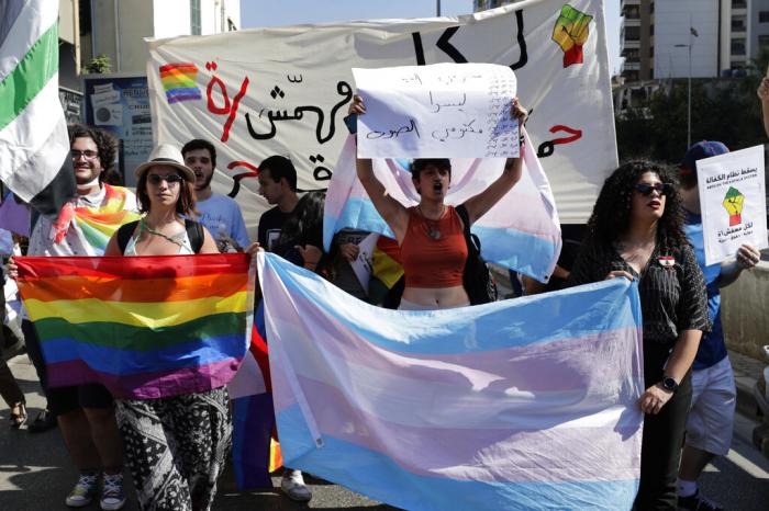 Activists from the Lesbian, Gay, Bisexual, and Transgender (LGBT) community in Lebanon shout slogans as they march calling on the government for more rights in the country gripped by economic and financial crisis during ongoing protests in Beirut, Lebanon, Saturday, June 27, 2020.