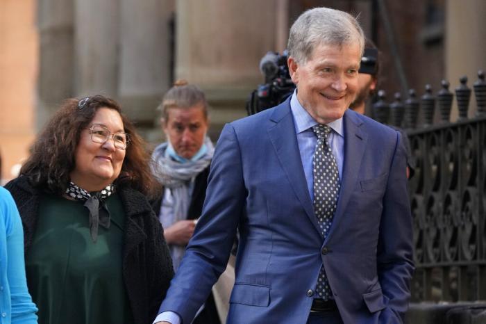 Steve Johnson, right, and his wife Rosemarie arrive at the Supreme Court in Sydney, Australia, on May 2, 2022, for a sentencing hearing in the murder of Scott Johnson, Steve's brother.