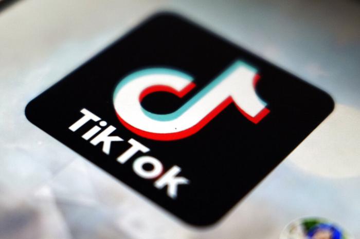 The TikTok app logo appears in Tokyo.