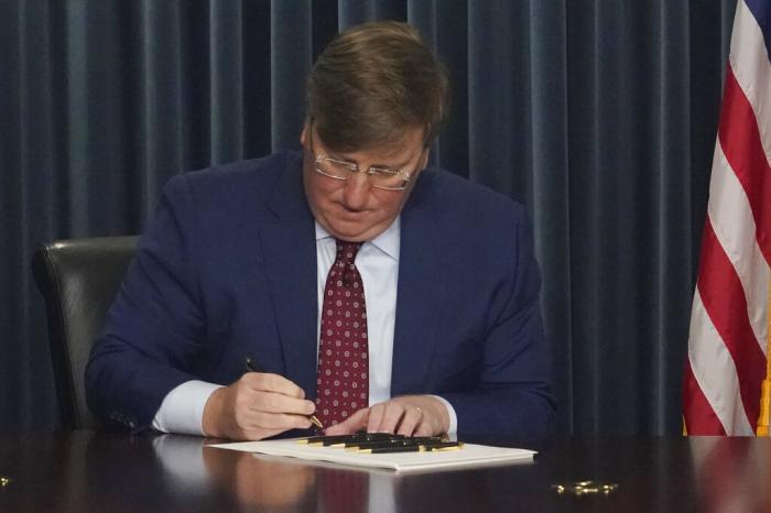 Mississippi Republican Gov. Tate Reeves signs a bill to ban gender-affirming care in the state for anyone younger than 18.