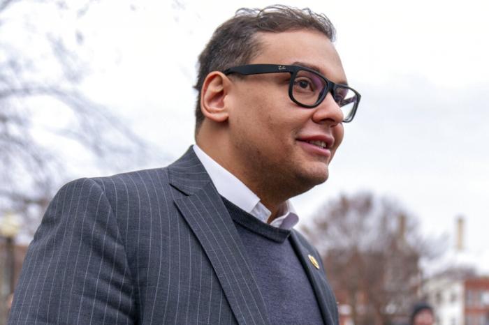 Rep. George Santos, R-N.Y., leaves a House GOP conference meeting on Capitol Hill in Washington.