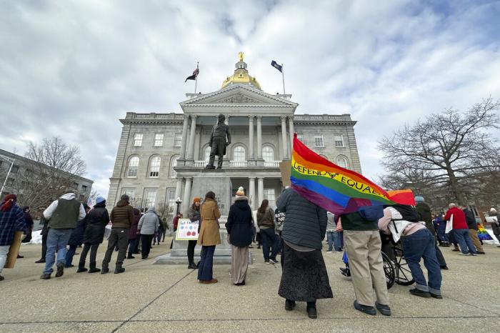 Advocates for transgender youth rally outside the New Hampshire Statehouse, in Concord, N.H., Tuesday, March 7, 2023. 