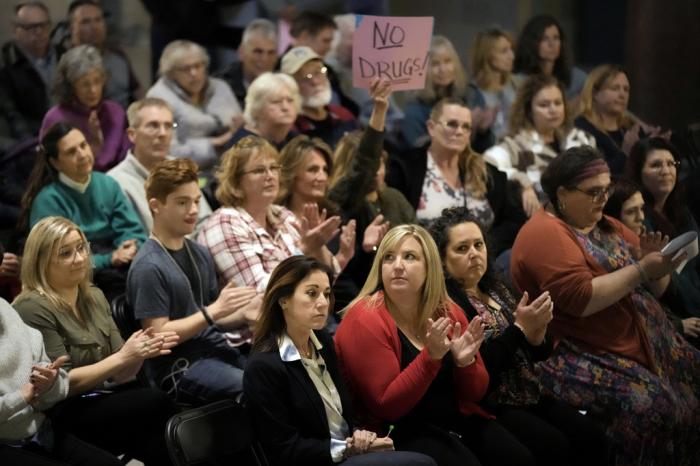 People applaud during a rally in favor of legislation banning gender-affirming healthcare for minors, Monday, March 20, 2023, at the Missouri Statehouse in Jefferson City, Mo.