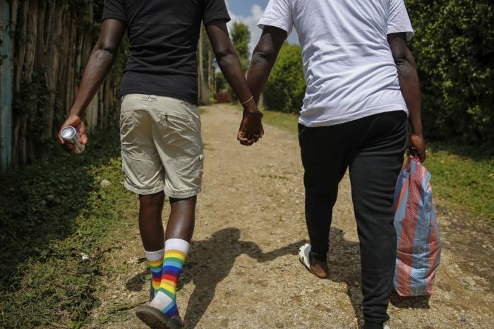 Gay Ugandan refugees who fled from their country to neighbouring Kenya, return after shopping for food in Nairobi, Kenya on June 11, 2020.