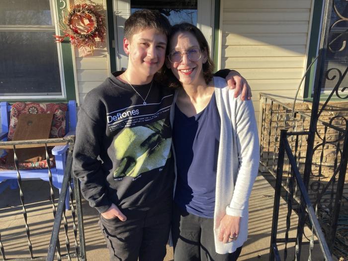Al Stone-Gebhardt and his mother, Erika Dubose, pose for a photo outside their home on Friday, March 3, 2023, in Tulsa, Okla. 