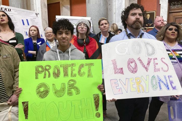 Transgender-rights advocates gather near the Kentucky House chamber on March 2, 2023, in Frankfort, Ky.