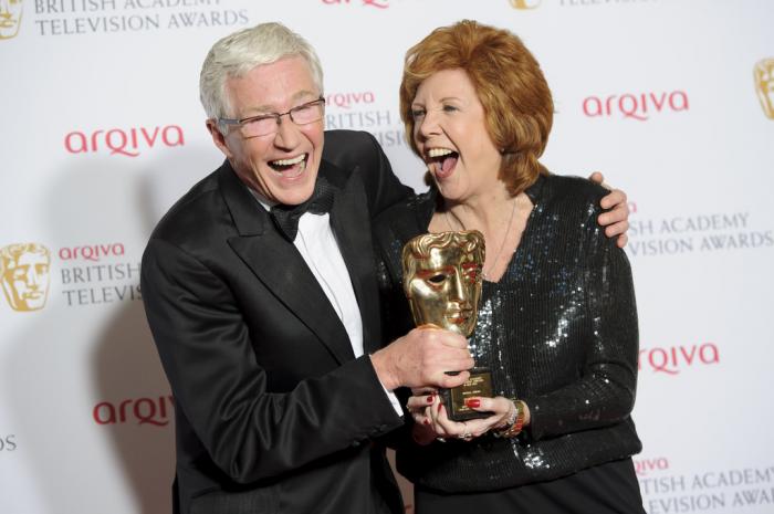 British presenters Paul O'Grady, left, and Cilla Black joke with her Special Award at the British Academy Television Awards at a central London venue, Sunday, May 18, 2014.