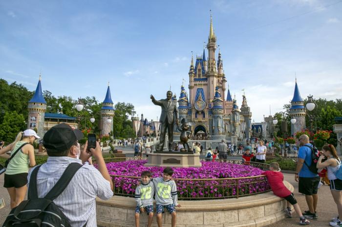 People visit the Magic Kingdom Park at Walt Disney World Resort in Lake Buena Vista, Fla., April 18, 2022. 