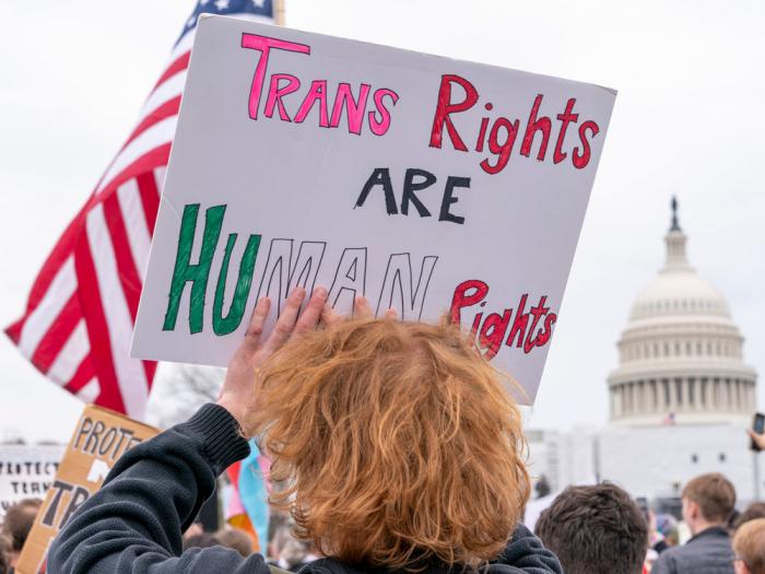 People attend a rally as part of a Transgender Day of Visibility, Friday, March 31, 2023, by the Capitol in Washington.