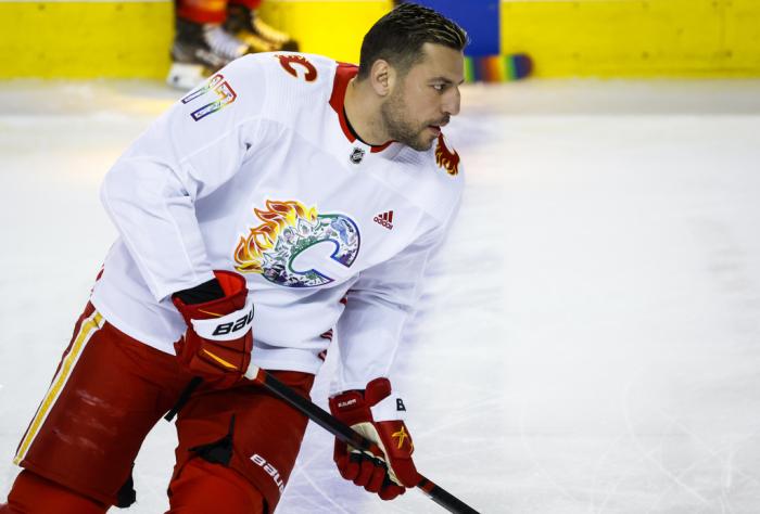 Calgary Flames forward Milan Lucic wears a Pride jersey while warming up for the team's NHL hockey game against the Los Angeles Kings on Tuesday, March 28, 2023, in Calgary, Alberta. 