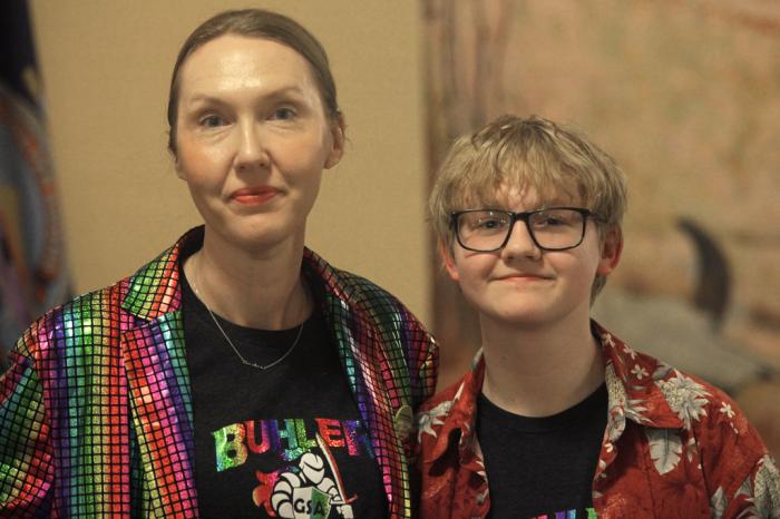 Cat Poland, of Buhler, Kansas, poses with her 13-year-old trans son, Alex, after a day of lobbying by LGBTQ youth and their advocates at the Statehouse, Tuesday, March 28, 2023, in Topeka, Kan. 