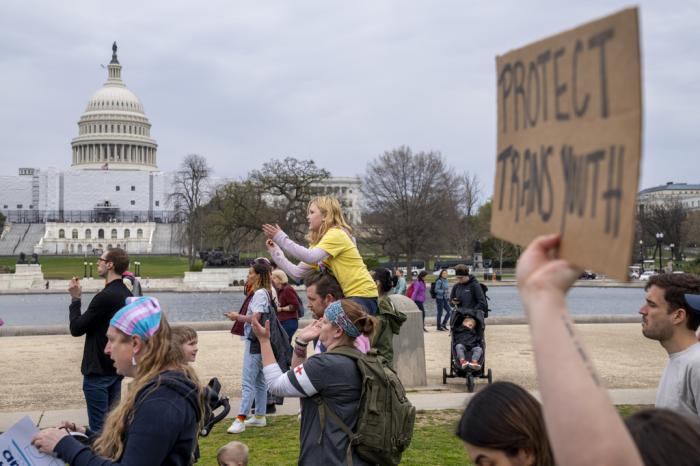People attend a rally as part of a Transgender Day of Visibility, Friday, March 31, 2023, by the Capitol in Washington. 
