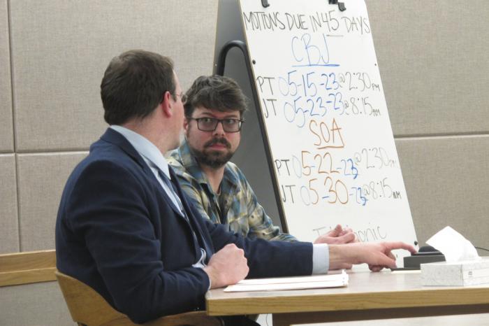 Mitchell Thomas Watley, right, listens to his attorney Nick Polasky before a scheduled court hearing on Tuesday, April 11, 2023, in Juneau, Alaska.