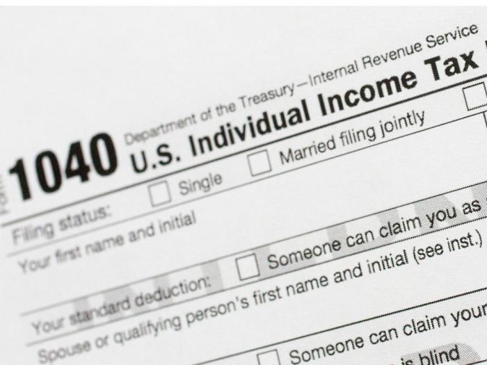 A portion of the 1040 U.S. Individual Income Tax Return form is shown July 24, 2018, in New York. The IRS has been tasked with looking into how to create a government-operated electronic free-file tax return system for all. Congress has directed the IRS to report in on how such a system might work. (AP Photo/Mark Lennihan, File)