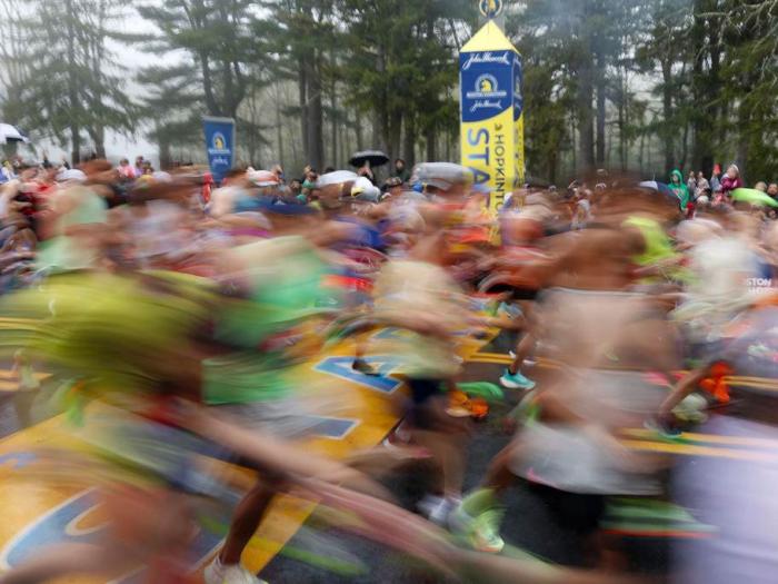 Runners cross the starting line during the 127th Boston Marathon, Monday, April 17, 2023, in Hopkinton, Mass. 