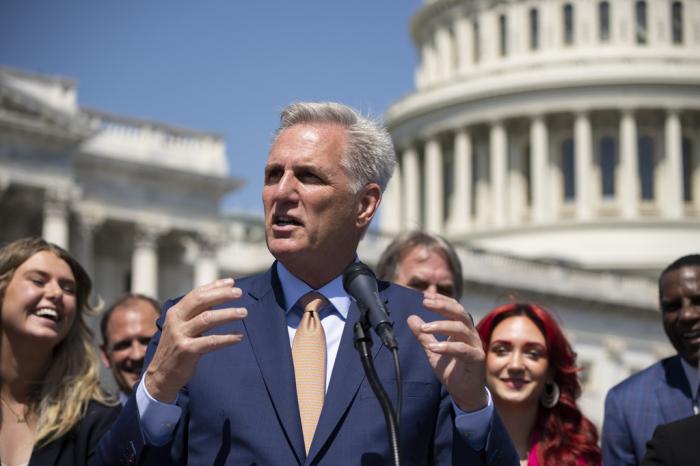Speaker of the House Kevin McCarthy, R-Calif., and House Republicans celebrate passage in the House of a bill that would bar federally supported schools and colleges from allowing transgender athletes whose biological sex assigned at birth was male to compete on girls or women's sports teams, at the Capitol in Washington, Thursday, April 20, 2023.