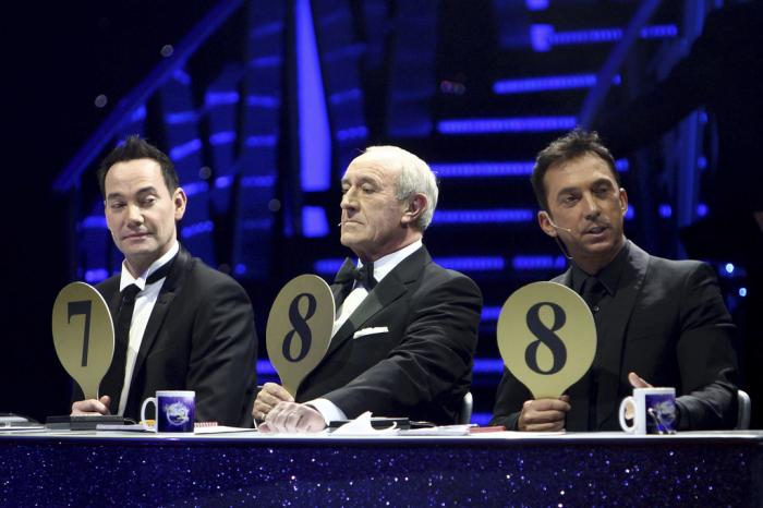 From left, judges Craig Revel Horwood, Len Goodman and Bruno Tonioli gesture, during the final dress rehearsal for the opening of the 'Strictly Come Dancing Live Tour' at the NIA, Birmingham, England, Jan. 20, 2012