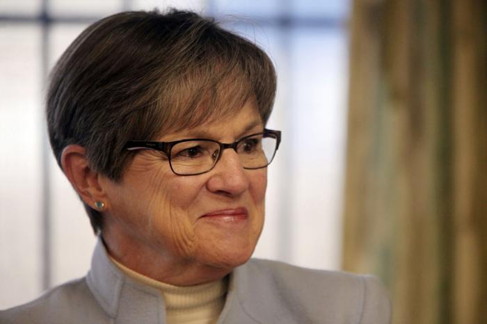 Kansas Gov. Laura Kelly pauses while answering questions from reporters during an event at a women's shelter, Jan. 23, 2023, in Topeka, Kan. 