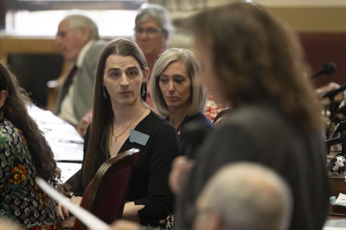 Rep. Zooey Zephyr looks on as Majority Leader Sue Vinton makes a motion discipline Rep. Zephyr during a session in the House of Representatives at the Montana State Capitol in Helena, Mont.