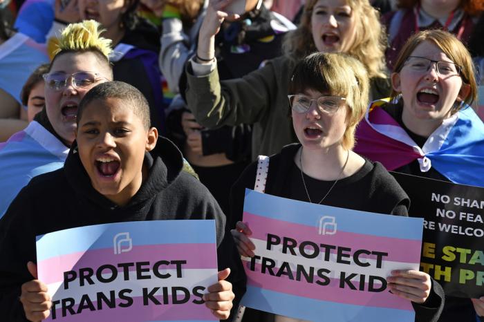 Protesters of Kentucky Senate bill SB150, known as the Transgender Health Bill, cheer on speakers during a rally on the lawn of the Kentucky Capitol in Frankfort, Ky., March 29, 2023. 