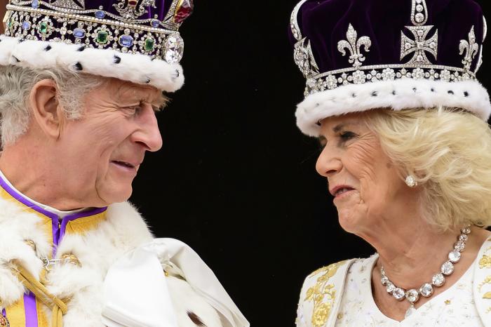 Britain's King Charles III and Queen Camilla look at each other as they stand on the balcony of the Buckingham Palace after their coronation, in London, Saturday, May 6, 2023. 