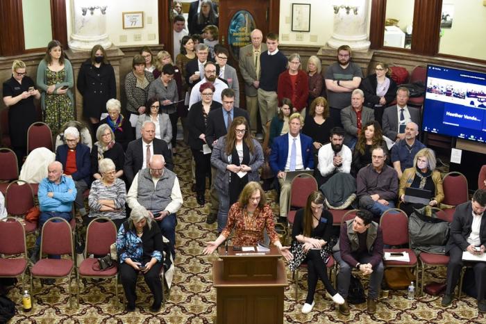 Opponents of a Montana bill banning gender-affirming medical care for transgender minors line up out the door of the Senate Judiciary Committee, Jan. 27, 2023, at the state Capitol in Helena, Mont. 