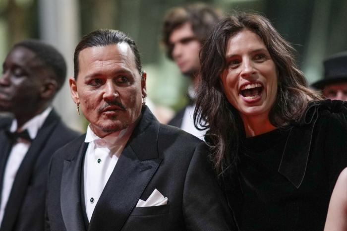 Johnny Depp, left, and director Maiwenn pose for photographers upon departure from the premiere of the film 'Jeanne du Barry' at the 76th international film festival, Cannes, southern France.