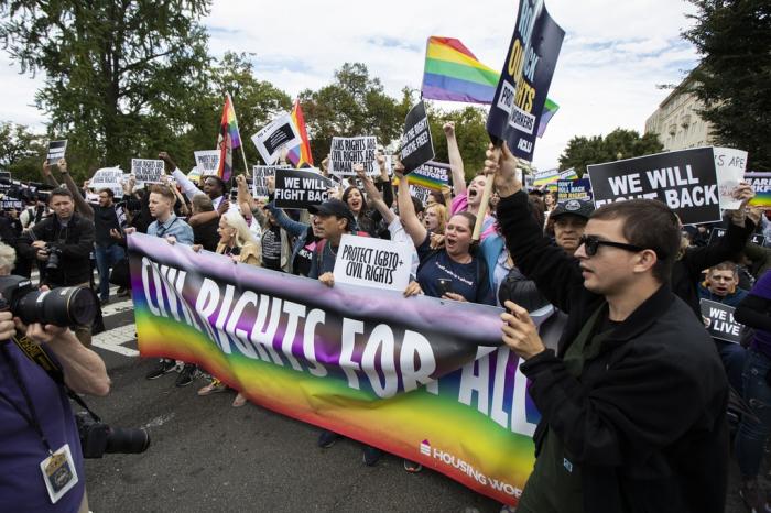 Supporters of LGBTQ rights stage a protest on the street in front of the U.S. Supreme Court on Oct. 8, 2019, in Washington.