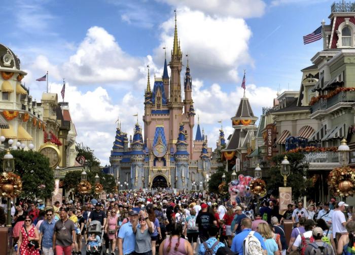 Crowds fill Main Street USA in front of Cinderella Castle at the Magic Kingdom on the 50th anniversary of Walt Disney World, in Lake Buena Vista, Fla., on Oct. 1, 2021. 