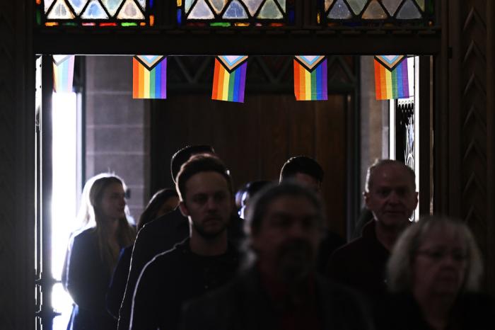 Friends and family arrive for a memorial service for Daniel Aston at Shove Memorial Chapel on the Colorado College campus on Dec. 7, 2022, in Colorado Springs, Colo.