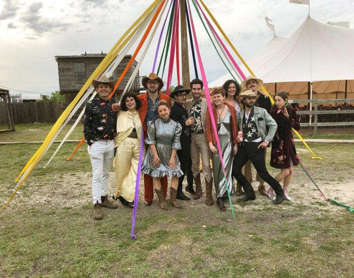 Wedding guests who adhered to the dress code of "Space Disco Cowboy," pose at a wedding in Austin, Texas on March 30, 2019.