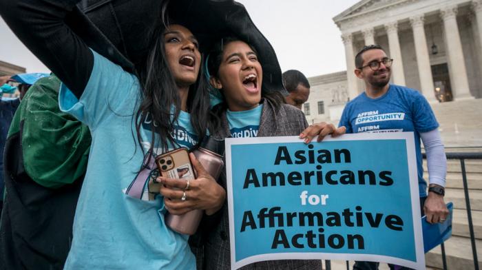 Harvard students Shruthi Kumar, left, and Muskaan Arshad, join a rally with other activists as the Supreme Court hears oral arguments that could decide the future of affirmative action in college admissions, in Washington, Oct. 31, 2022.