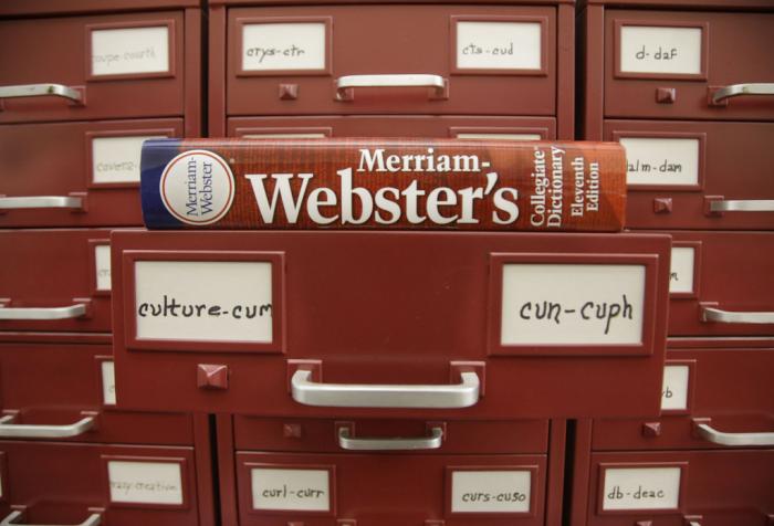 A Merriam-Webster dictionary sits atop their citation files at the dictionary publisher's offices on Dec. 9, 2014, in Springfield, Mass.