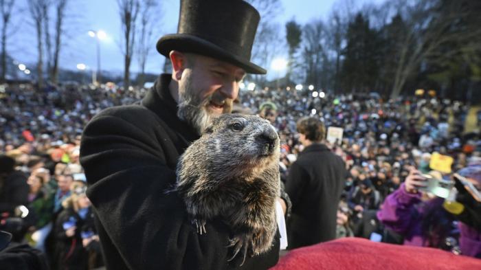 Groundhog Club handler A.J. Dereume holds Punxsutawney Phil, the weather prognosticating groundhog, during the 138th celebration of Groundhog Day on Gobbler's Knob in Punxsutawney, Pa., Friday, Feb. 2, 2024.