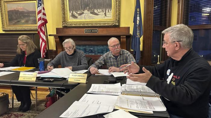 Littleton town manager Jim Gleason, right, talks to the town's selectmen during a meeting on Jan. 22, 2024, in Littleton, N.H. 