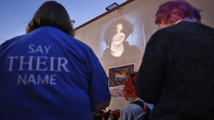 A photograph of Nex Benedict, a nonbinary teenager who died a day after a fight in a high school bathroom, is projected during a candlelight service at Point A Gallery, Saturday, Feb. 24, 2024, in Oklahoma City. 