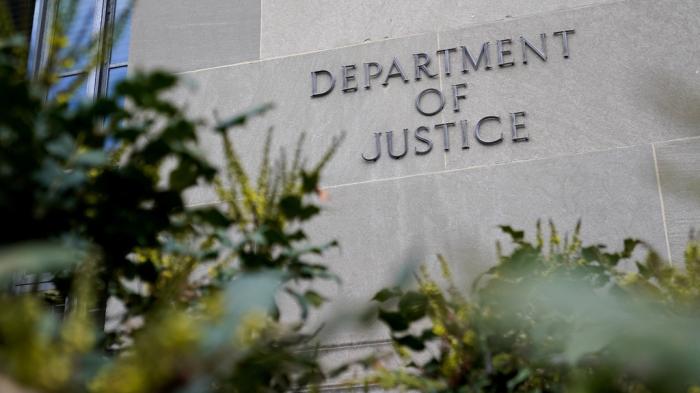 A sign marks an entrance to the Robert F. Kennedy Department of Justice Building in Washington, Jan. 23, 2023.